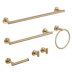 an image of bathroom accessories set in gold color on white background, including towel ring and toilet paper holder