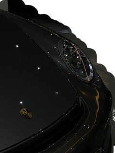 the front end of a black sports car