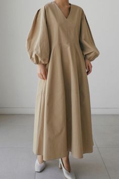 Details: Material: Polyester Style: Casual. Simplicity Pattern Type: Solid Neckline: V Neck Silhouette: A Line Sleeve Style: Lantern Sleeve Sleeve Length: Long Sleeve Fit Type: Loose Clothing Length: Long Type: Solid Color Size(in) Bust Dresses Length S 39.4 45.3 M 40.9 45.7 L 42.5 46.1 XL 44.1 46.5 Tips:Due to the many variations in monitors. the color in the image could look slightly different. please take physical design and color shall prevail.Please allow 0.4"-1" differs due to manual measurement. Estilo Hijab, Solid Maxi Dress, Winter Party Dress, Autumn Dress, Khaki Dress, Pleated Midi Dress, Loose Outfit, Long Puff Sleeves, Maxi Dresses Casual