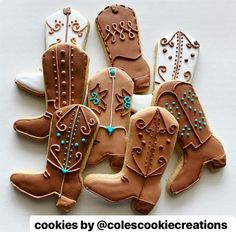 decorated cookies in the shape of cowboy boots and boots