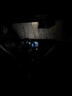 the interior of a car is lit up at night