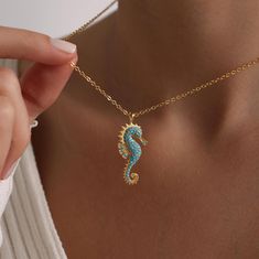 Welcome to the Magical World of PKJewelry Beach Jewelry Necklace Gold Plated Sea Horse Pave Necklace is perfect as a special gift for her. This Sea Horse necklace is a great choice as a gift for Mother's Day, Birthday, Anniversary, Valentines Day, Christmas. Our high quality products are specially prepared for you with great care. The gold plating on it is much thicker than other platings. Therefore, it is a nice gift to be used for a long time. Our products do not tarnish and are anti-allergic. - Our chains are sent with 16 inch and 2 inch extension chain. You can adjust it to the size you want. If you want it shorter or longer, please contact us.  All Our Animal Necklace  https://www.etsy.com/shop/PKJewelryNecklace?ref=shop-header-name&listing_id=1794870106&from_page=listing&search_query Sea Horse Jewelry, Sea Horse Necklace, Ocean Accessories, Seahorse Jewelry, Seahorse Necklace, Pave Necklace, Beach Necklace, Animal Necklace, Special Gifts For Her