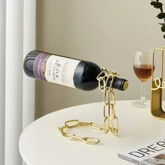 a bottle of wine is chained to a table