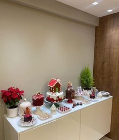 a table with several cakes and decorations on it