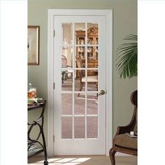 a white door with glass panels in a living room