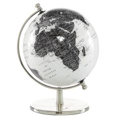 a white and black globe on a metal stand