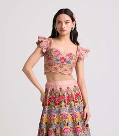 Capture the essence of elegance in this soft pink chanderi bustier, adorned with intricate multicolor floral threadwork and delicate beadwork. This enchanting piece exudes sophistication and charm, perfect for adding a touch of romance to your ensemble. Luxury Pink Choli With Floral Embroidery, Festive Pink Floral Embellished Sets, Bohemian Pink Set With Floral Embroidery, Fitted Pink Floral Embroidered Set, Pink Semi-stitched Choli With Floral Embroidery, Pink Closet, Floral Bustier, International Style, Pink Fabric