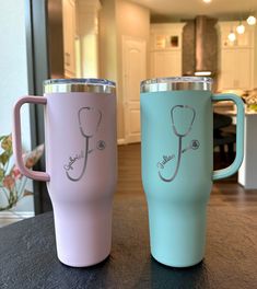 two coffee mugs with stethoscope designs on them