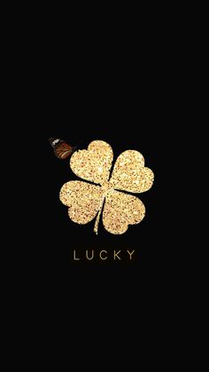 a four leaf clover with the word lucky on it and a butterfly flying over it