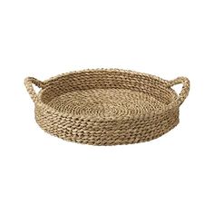 a round woven basket with handles on a white background, it is made out of straw