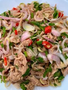 a white plate topped with meat and veggies