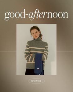 a woman is wearing a sweater and standing with her hands on her hips, in front of a poster that says good - afternoon