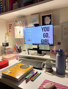 a desk with a computer monitor and keyboard