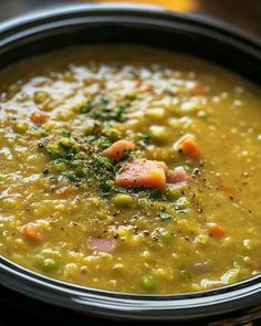 a close up of a bowl of soup on a table