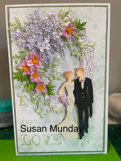 a wedding card with an image of a bride and groom