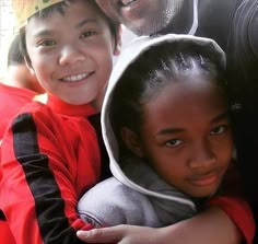 two children and an adult posing for a photo