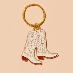 • Soft enamel keychain • Measures approximately 2”. • Designed and packaged in Columbus, OH • Manufactured in Taiwan • Artwork by Meghan Hopkins Sokorai Cowboy Boot Keychain, Enamel Keychain, Soft Enamel, Cowboy Boot, Western Cowboy Boots, Western Cowboy, Columbus, Cowboy Boots, Taiwan