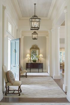 the hallway is clean and ready for guests to use it as an entrance way in this home