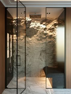 a walk in shower sitting inside of a bathroom