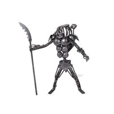 a metal figurine holding a sceptacle and a knife in his hand