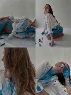 a woman is sitting on the floor with blue paint all over her face and body