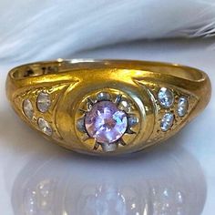 BEAUTIFUL Estate 18K 750 Yellow Gold Pink Gemstone Statement Ring Size 9.75 A very beautiful , well-made ring, crafted in solid 18k 750 yellow gold! * This unique ring would make a great gift! * Weight: 2.9 grams * Center round pink gemstone (I believed CZ) surrounded by 3 clear round stones on each side. * Size 9.75 Will ship FAST and FREE, fully insured and gift boxed! Unusual Rings, Mens Ring, Pink Gemstones, Unique Ring, Multi Stone Ring, Multi Stone, Statement Ring, Unique Rings, Stone Rings