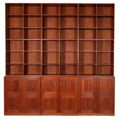 a wooden bookcase with four doors and two shelves on each side, in the shape of bookshelves