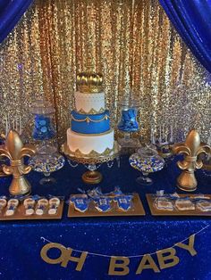 a blue and gold baby shower is set up