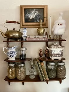 shelves with jars, books and other items on them