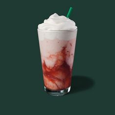 a drink with whipped cream on top and a green straw