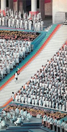 a large group of people in white uniforms