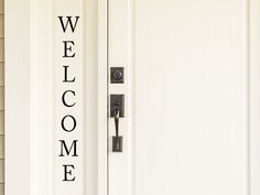 a welcome sign on the front door of a house