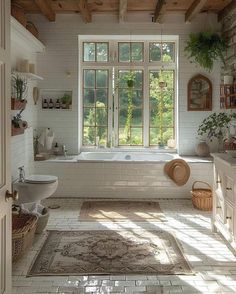 a bathroom with a tub, toilet and sink in it's center window sill