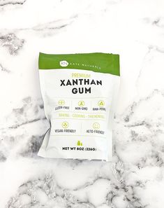 a bag of xanthan gum sitting on top of a white marble countertop