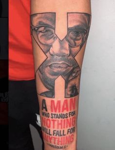 a man with glasses on his face has a quote from martin luther king tattooed on his arm