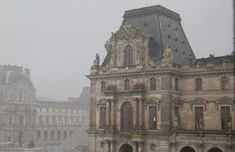 an old building is shown in the fog