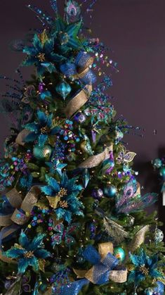 a decorated christmas tree with blue and gold decorations