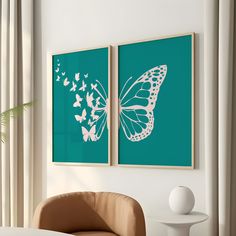 two butterfly paintings on the wall above a chair in front of a table with a vase