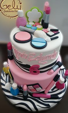 a birthday cake decorated with makeup and cosmetics