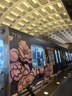 a subway train with graffiti on the side