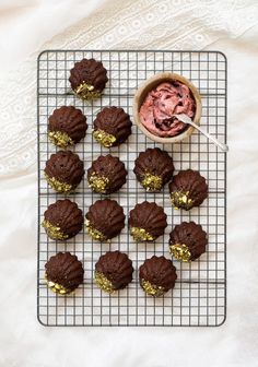 chocolate cupcakes with gold sprinkles and a bowl of ice cream