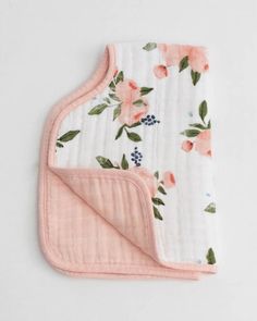 a blanket with pink flowers on it