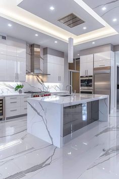 a large kitchen with marble floors and white cabinets