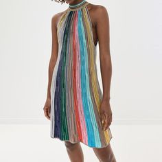 Chic Knit Halter Neck Dress, Chic Multicolor Vertical Stripes Dress, Spring Sleeveless Mini Dress With Vertical Stripes, Striped Ribbed Mini Dress, Striped Ribbed Mini Length Dresses, Chic Striped Sleeveless Mini Dress, Striped Halter Neck Mini Dress For Spring, Chic Striped Knit Dresses, Striped Sleeveless Midi Dress For Party