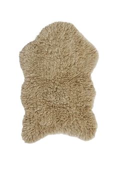 a beige sheepskin rug is shown on a white background, with the top half of it