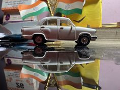 a toy car sitting on top of a table