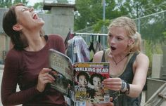 two young women laughing and reading the walking dead magazine