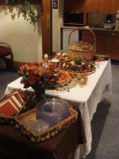 an arrangement of flowers on a table in a room