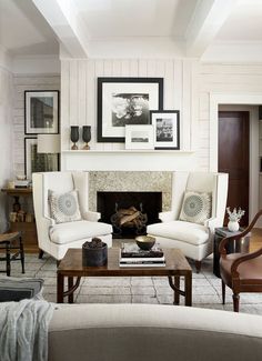 a living room filled with furniture and a fire place