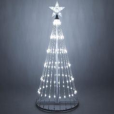 a lighted christmas tree with white lights on it's sides and a star in the middle